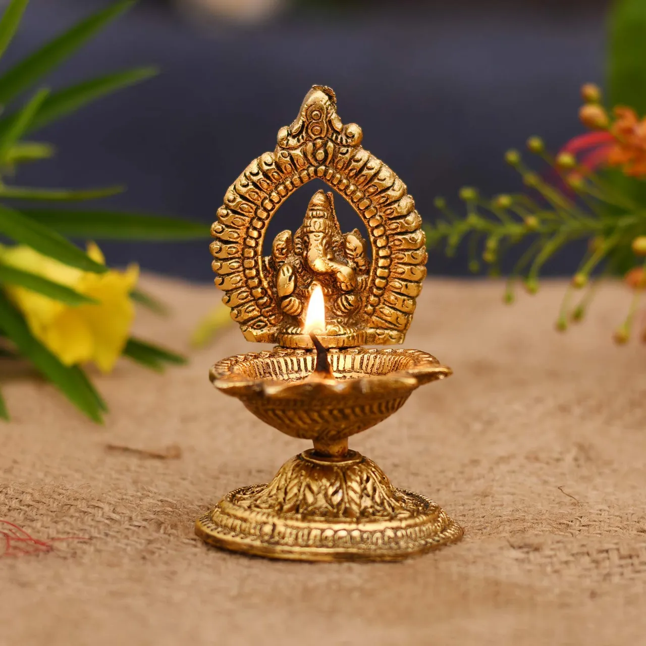 Ganesha Who Holds The Flame